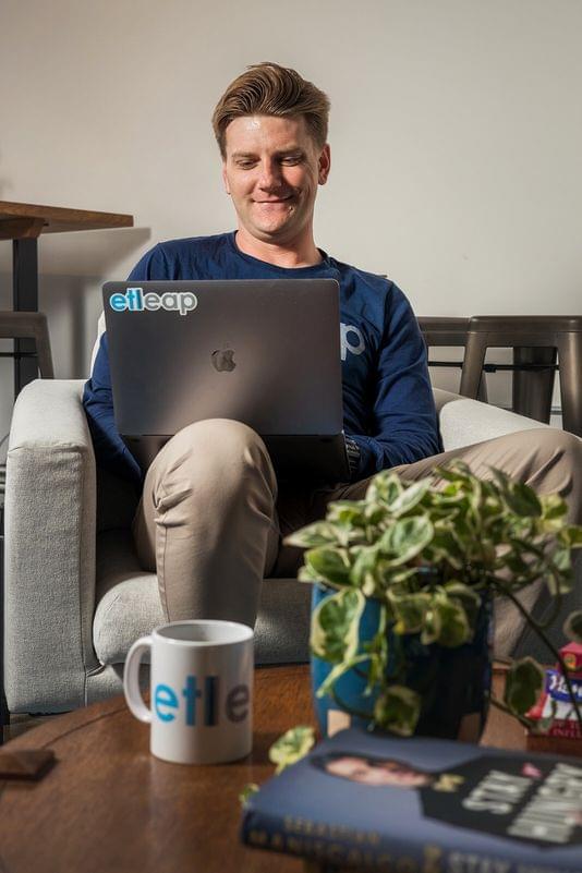 team member working on laptop